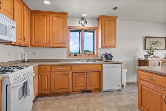 kitchen with white appliances and sink