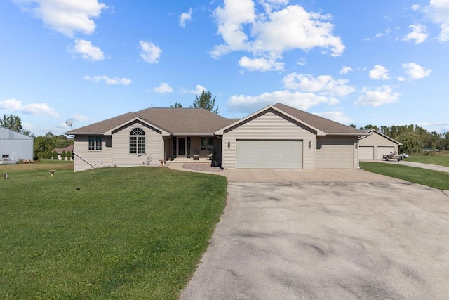 ranch-style house featuring a garage and a front yard