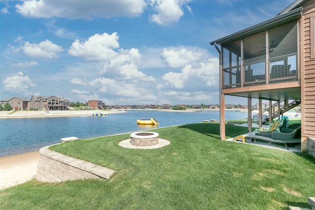 property view of water featuring a fire pit