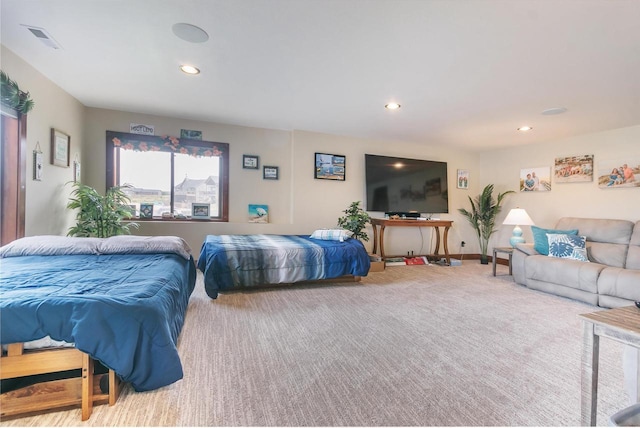 bedroom featuring light carpet