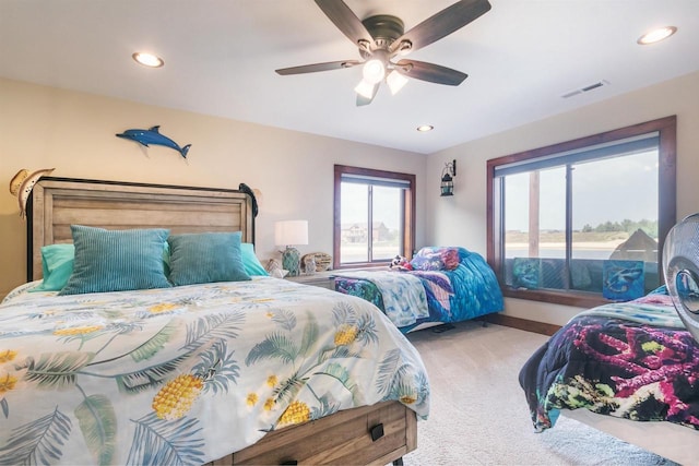 bedroom with ceiling fan and carpet