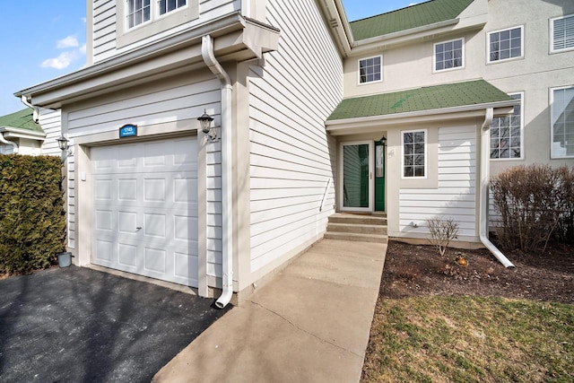 entrance to property featuring a garage