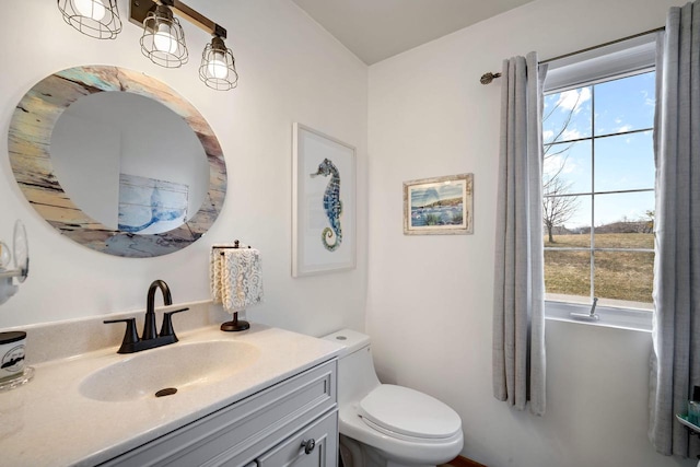 bathroom with vanity and toilet