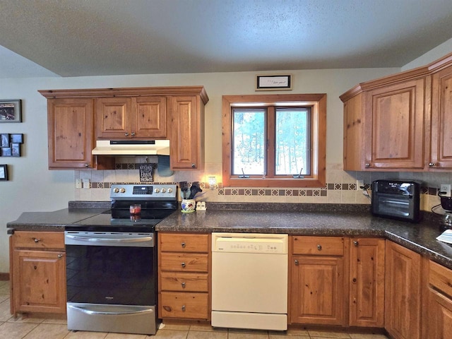 kitchen with white dishwasher, tasteful backsplash, stainless steel range with electric stovetop, and light tile patterned flooring