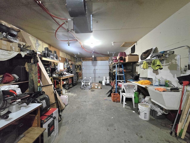 garage featuring sink and a workshop area