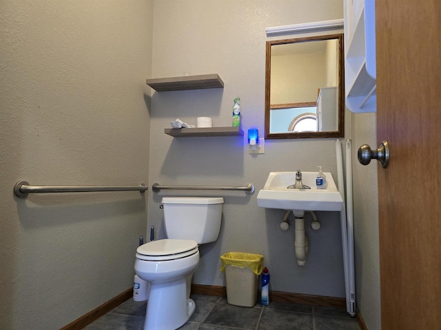 bathroom featuring tile patterned floors and toilet