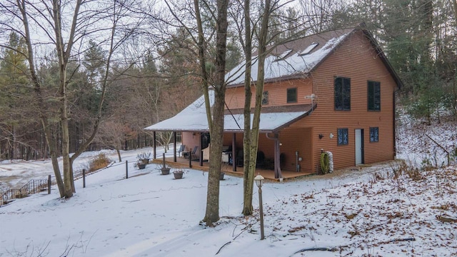 view of snow covered house