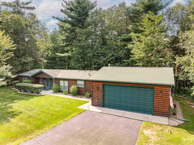 log cabin with a garage and a front yard