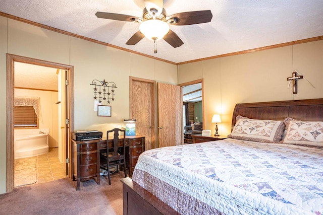 carpeted bedroom featuring crown molding, ensuite bath, and a textured ceiling