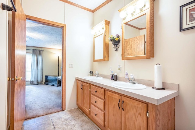 bathroom with crown molding and vanity