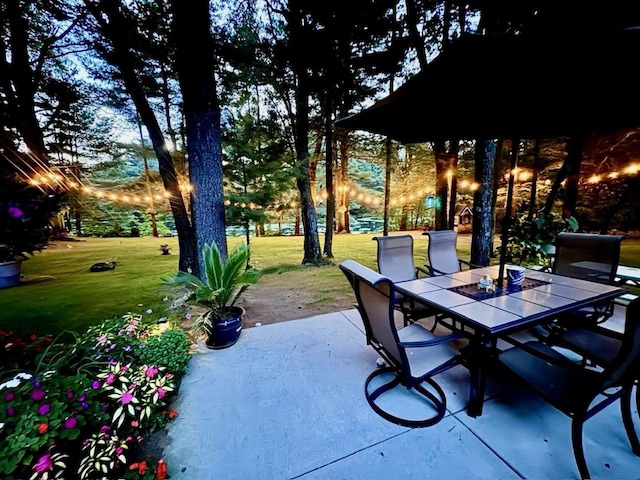 patio terrace at dusk with a lawn