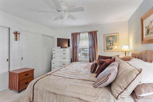 bedroom featuring ceiling fan, a closet, and light carpet