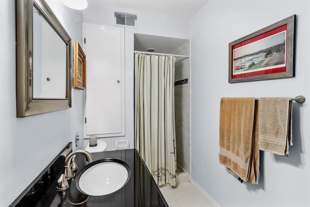 bathroom featuring vanity and walk in shower