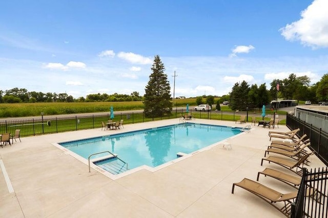 view of swimming pool with a patio