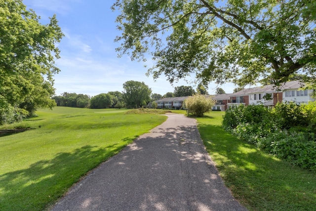 surrounding community featuring a lawn