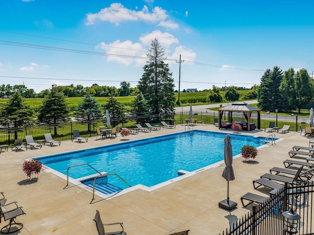 view of pool featuring a gazebo and a patio