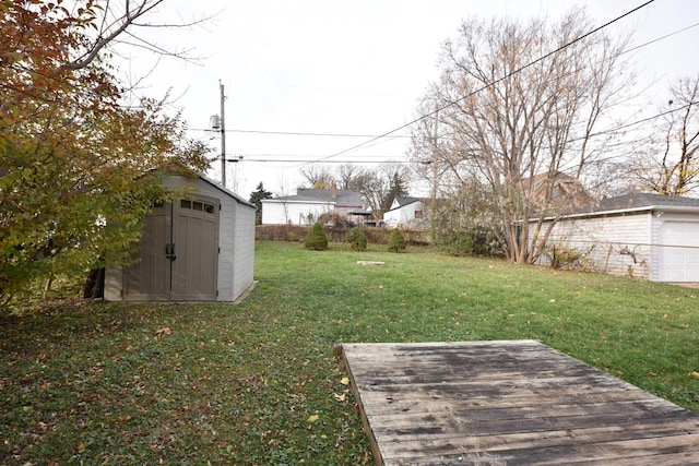 view of yard featuring a shed and a deck