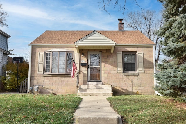 bungalow with a front yard