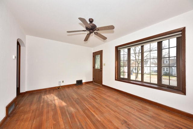 spare room featuring ceiling fan and wood-type flooring