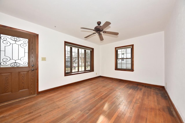 foyer entrance with ceiling fan and dark hardwood / wood-style flooring