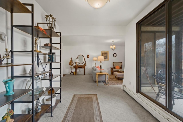 interior space featuring light colored carpet and a baseboard heating unit