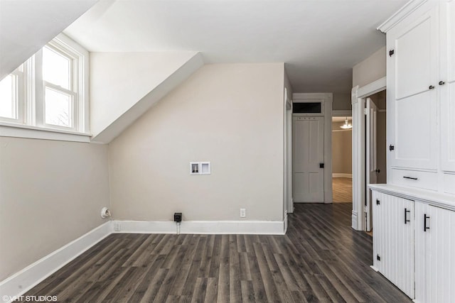 additional living space featuring dark hardwood / wood-style flooring