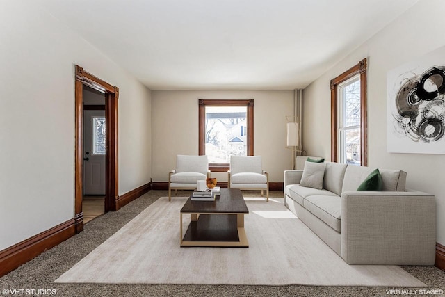 living room featuring carpet floors and plenty of natural light