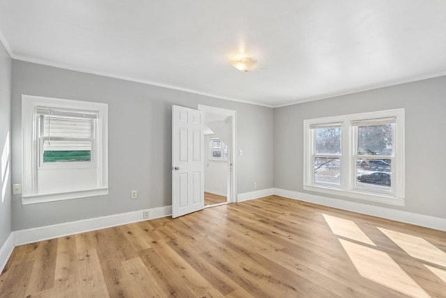 interior space featuring light wood-style floors and baseboards