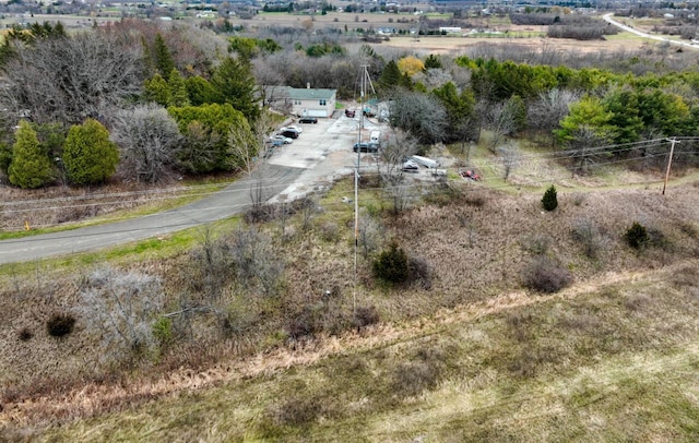 birds eye view of property with a rural view