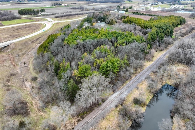 drone / aerial view featuring a water view and a rural view