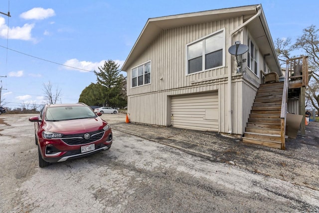 view of side of property with a garage