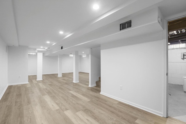 basement featuring light wood-type flooring