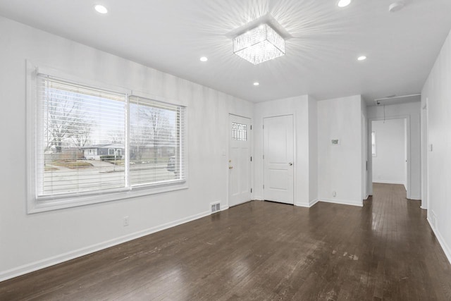 spare room featuring dark hardwood / wood-style floors