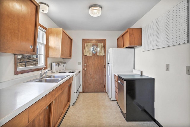 kitchen featuring white appliances, light floors, a sink, light countertops, and brown cabinets