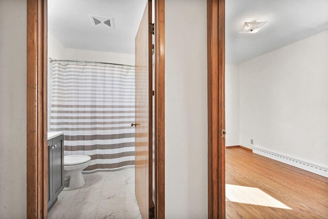 bathroom with visible vents, a baseboard heating unit, toilet, marble finish floor, and vanity