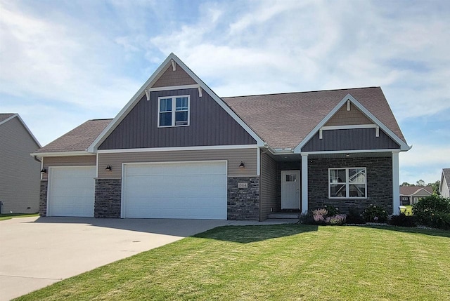 craftsman house featuring a garage and a front yard