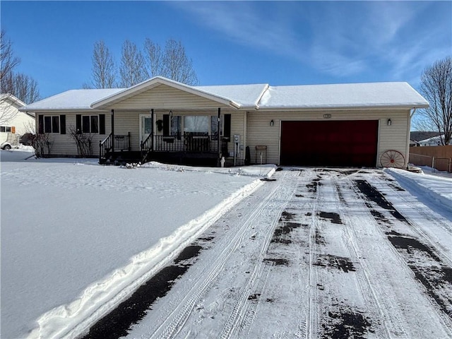 single story home with a garage and covered porch