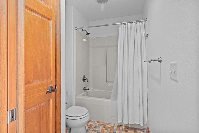 bathroom with shower / bath combination with curtain and toilet