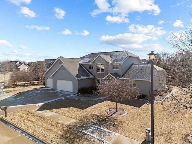 front of property with a garage