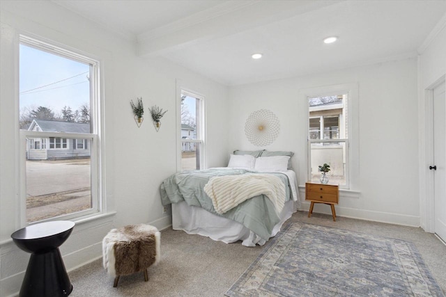 bedroom featuring beamed ceiling and carpet