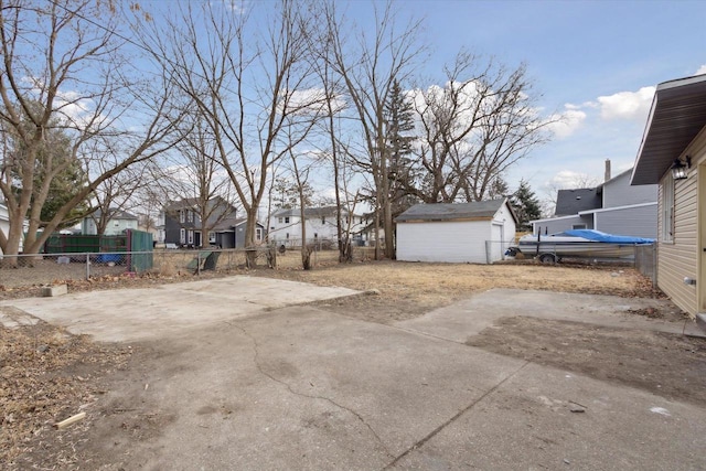 view of yard with a shed and a patio