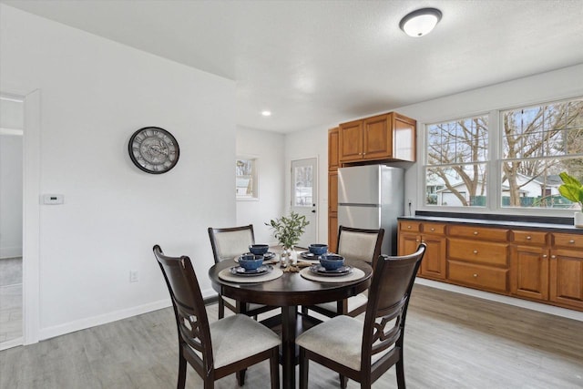 dining space featuring light hardwood / wood-style flooring