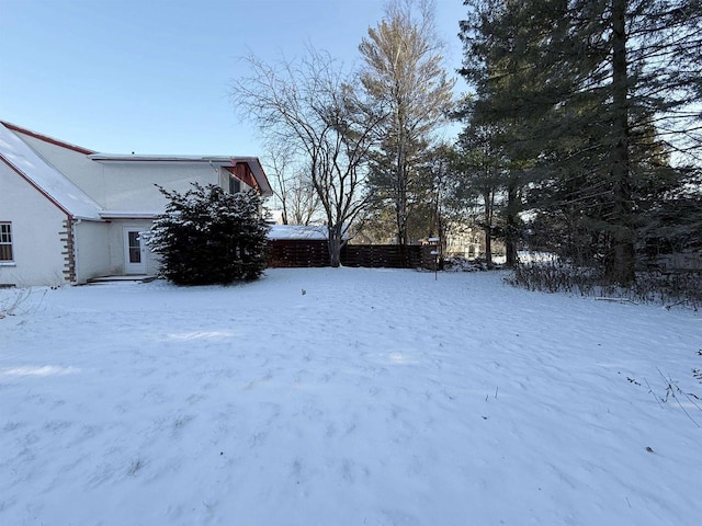 view of yard covered in snow