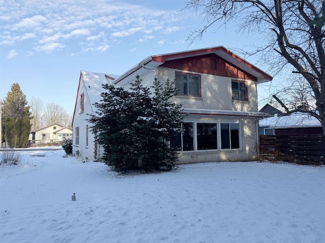 view of snow covered house