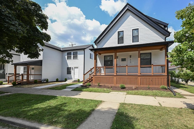 view of front of home featuring a porch and a front yard