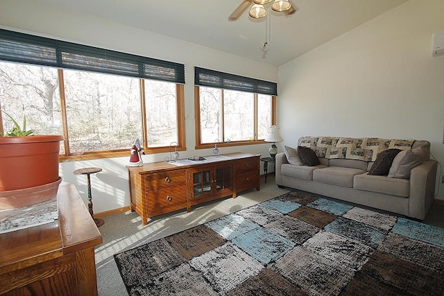 W5698 Losinski Rd, Princeton, WI 54968 - carpeted living room featuring ceiling fan, vaulted ceiling, an AC wall unit, and baseboards