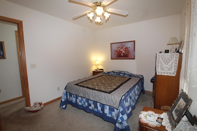 W5698 Losinski Rd, Princeton, WI 54968 - bedroom with carpet, baseboards, and a ceiling fan