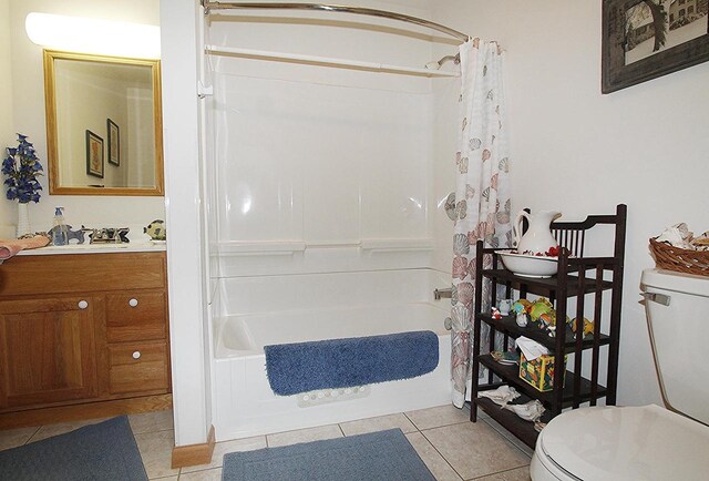 W5698 Losinski Rd, Princeton, WI 54968 - bathroom with toilet, tile patterned flooring, shower / bathtub combination with curtain, and vanity