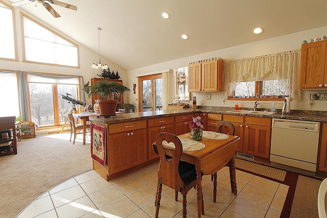 W5698 Losinski Rd, Princeton, WI 54968 - kitchen with white dishwasher, a sink, a peninsula, healthy amount of natural light, and recessed lighting