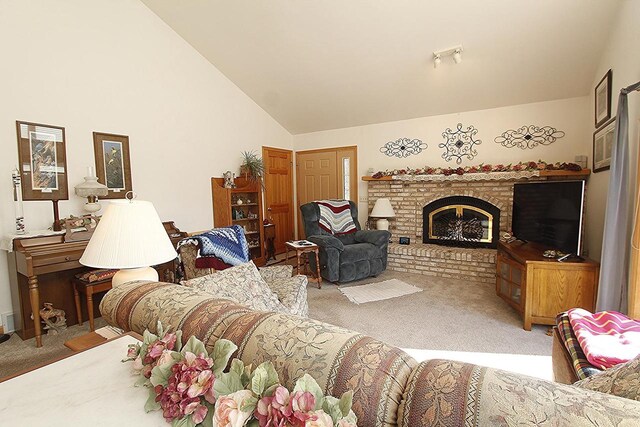 W5698 Losinski Rd, Princeton, WI 54968 - carpeted living area with lofted ceiling and a fireplace